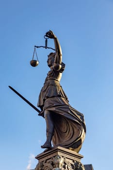 Frankfurt, Germany - February 28, 2023: Statue of Lady Justice (Justitia) in Frankfurt, Germany.