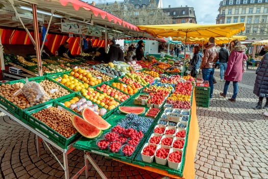 Wiesbaden, Germany - February 25, 2023: farmers sell fresh vegetables and fruits at the farmers market in Wiesbaden to local people.