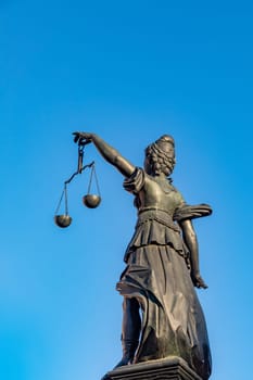 Frankfurt, Germany - February 28, 2023: Statue of Lady Justice (Justitia) in Frankfurt, Germany.