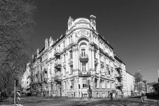 Wiesbaden, Germany - March 2, 2023: people at Kaiser Friedrich Ring - engl: King Friedrich circle - with its old scenic facade of the 19th century in classicistic and Art Nouveau style.