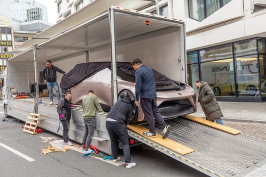 Frankfurt, Germany - March 21, 2023: NIO EVE Concept Self-driving Electric Car  is unloaded from a van to be placed in NIO showroom in Frankfurt.