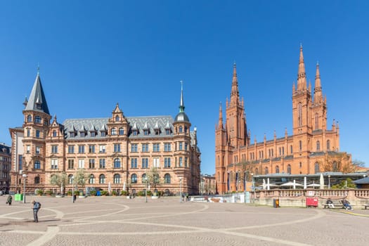 Wiesbaden, Germany - April 4, 2023: Dernsches Gelaende, left with new town hall and at right side the Marktkirche called market church.