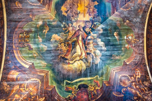 Braga, Portugal - May 1, 2023: painting at the wooden ceiling at Sé de Braga Cathedral Interior - Braga, Portugal.