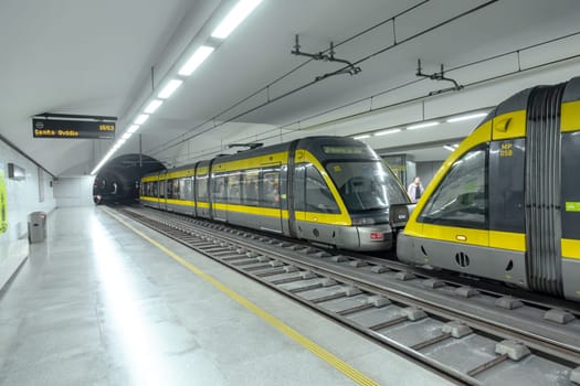 Porto, Portugal - May 3, 2023: metro stops at metro station faria guimaraes with modern metro in Porto, Portugal.