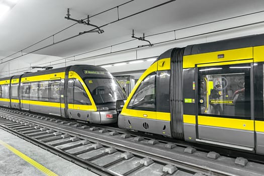 Porto, Portugal - May 3, 2023: metro stops at metro station faria guimaraes with modern metro in Porto, Portugal.