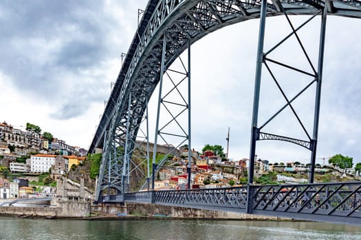 Porto, Portugal - May 3, 2023:view to old town of Porto with view through famous iron bridge Dom Luis I.