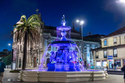 Porto, Portugal - May 4, 2023: Fountain and the baroque Igreja do Carmo, Church of the Song, in Porto.