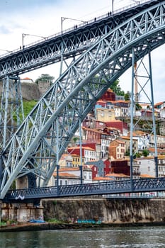 Porto, Portugal - May 3, 2023:view to old town of Porto with view through famous iron bridge Dom Luis I.