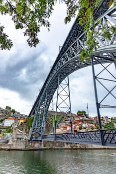 Porto, Portugal - May 3, 2023:view to old town of Porto with view through famous iron bridge Dom Luis I.