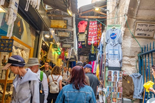 Jerusalem, Israel - May 19, 2023: people visit the market and bazaar in the old town at Muristan street, east Jerusalem.