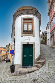 Porto, Portugal - May 4, 2023: small house in the old town of Porto with narrow roads.