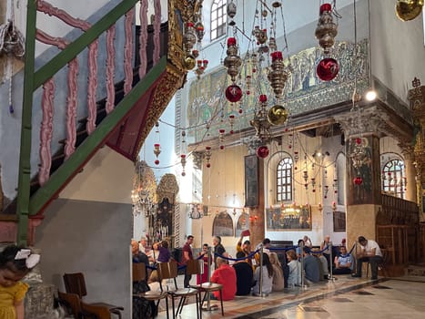 Bethlehem, Israel - May 19, 2023: people visit the church of Nativity in Jerusalem.