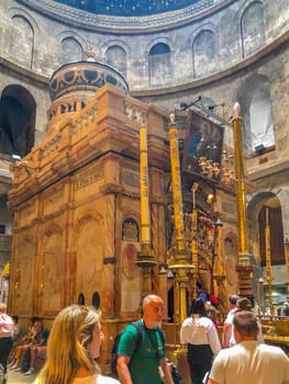 Jerusalem, Israel - May 19, 2023: Visitors are touring the Church of the Holy Sepulchre during Holy Week in the Old City of Jerusalem.