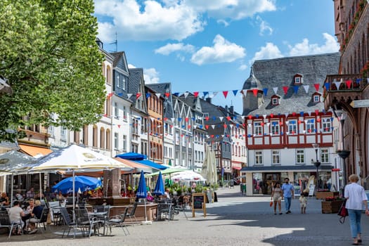 Montabaur, Germany - June 15, 2023: people enjoy visiting old town of Montabaur with lovingly restored half-timbered buildings from the 16th and 17th centuries.