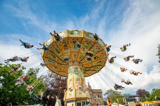 Wiesbaden, Germany - June 8, 2023: The Wilhelm street festival is a big festival in Hesse, Germany.. The visitors have lot of fun with many amusement huts and big carousels.