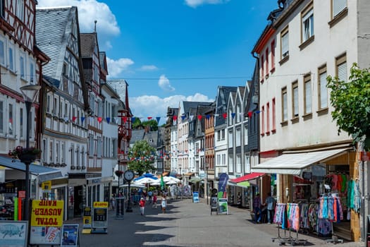 Montabaur, Germany - June 15, 2023: people enjoy visiting old town of Montabaur with lovingly restored half-timbered buildings from the 16th and 17th centuries.