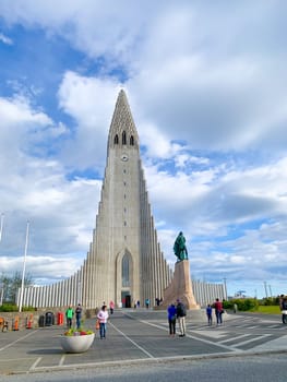 Reykjavík, Iceland - July 13, 2023: tourists visit modern Hallgrimskirkja church in the center of Reykjaivk, Iceland