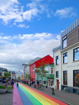 Reykjavík, Iceland - July 13, 2023: The Gay Pride rainbow from Skólavörðustígur street, one of the busiest streets leading to Hallgrimfrikja church. Once painted for Reykjavik Pride week, now permanent