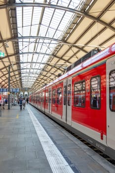 Frankfurt am Main, Germany - August 10, 2023: people at the central train station in Frankfurt hurry to the train.