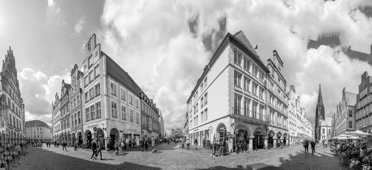 Muenster, Germany - August 5, 2023: people visit the historiv prinzipalmarkt at the town of Muenster, Germany.