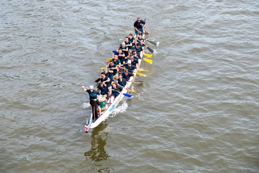 Frankfurt, Germany - August 26, 2023: people have fun visiting the Dragon boat race at the Museumsuferfest - engl: festival of the Museums at the river - in Frankfurt.