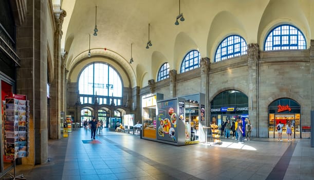 Frankfurt am Main, Germany - August 10, 2023: people at the central train station in Frankfurt hurry to the train.