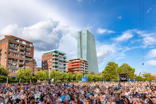 Frankfurt, Germany - August 31, 2023: people enjoy the open air festival with the HR synphony orchestra and big band at the Weseler werft in Frankfurt.