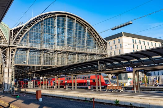 Frankfurt, Germany - September 11, 2013: people at Frankfurt train station arrive with a local red train. Most of them hold a 49 Euros reduced germany ticket.
