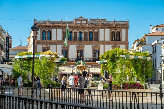 Ronda, Spain - September 25, 2023: Plaza del socorro, Ronda. Flag and Emblem of Andalusia. Plaza del Socorro, Ronda, Málaga, Andalucia, Spain, Europe