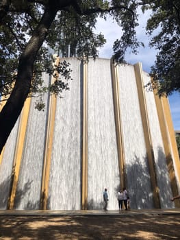 Houston, USA - October 21, 2023: scenic water wall in Houston  built in 1985 with 11000 Gallons water per minute with reminiscent of an ancient roman theater stage.