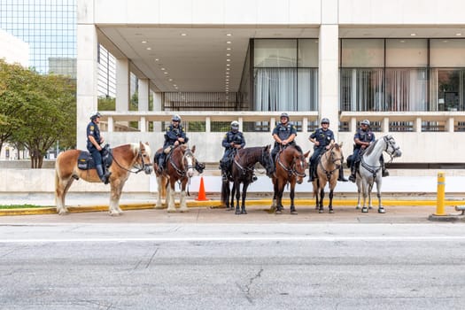 Houston, USA - October 20, 2023: houston police men at horses are.ready to protect the demonstration against violence.