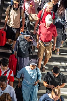 Würzburg, Germany - September 11, 2013: people at Würzburg train station wait for the train. Most of them hold a 49 Euros reduced germany ticket.