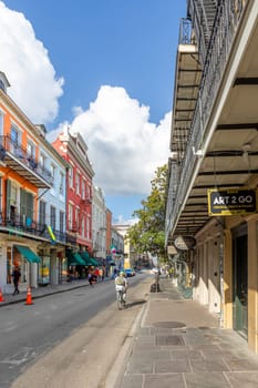 New Orleans, USA - October 24, 2023: tourists go shopping in the old royal street of the french quarter in New Orleans, Louisiana, USA.