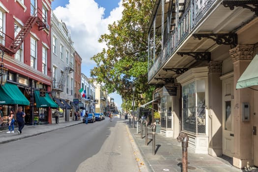 New Orleans, USA - October 24, 2023: tourists go shopping in the old royal street of the french quarter in New Orleans, Louisiana, USA.