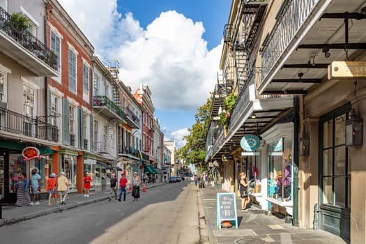 New Orleans, USA - October 24, 2023: tourists go shopping in the old royal street of the french quarter in New Orleans, Louisiana, USA.