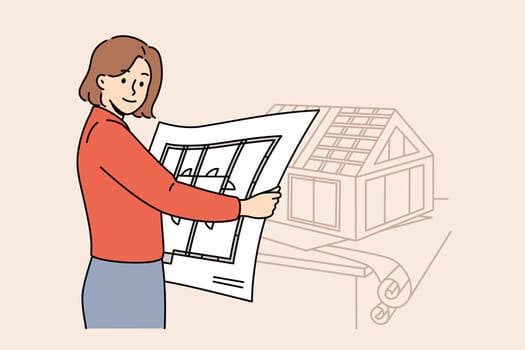 Woman architect creates engineering plans and models of future houses, working in construction office. Girl architect from architectural company holds room-by-room plan of mansion and looks at screen