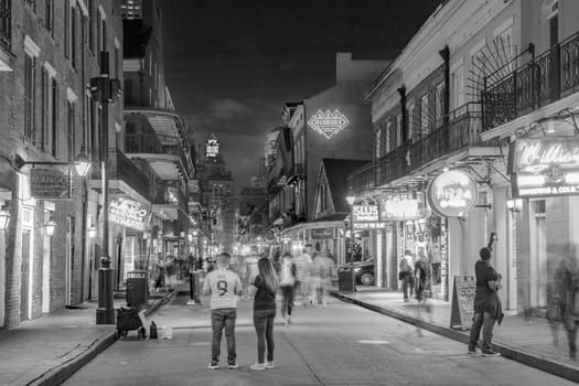 New Orleans, USA - October 24, 2023: Pubs and bars with neon lights in the French Quarter, downtown New Orleans.