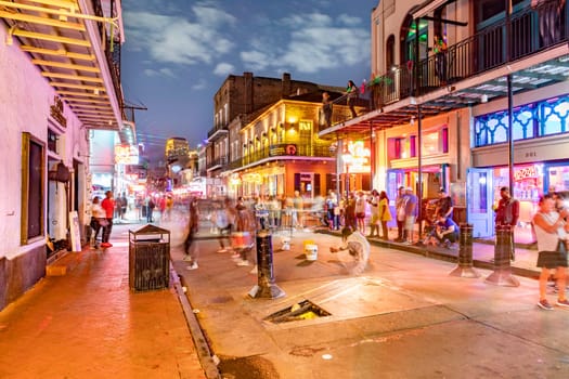 New Orleans, USA - October 24, 2023: Pubs and bars with neon lights in the French Quarter, downtown New Orleans.