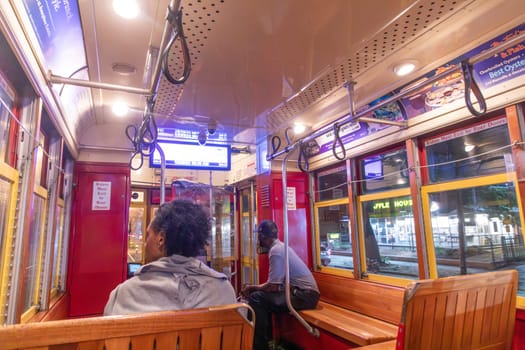 New Orleans  USA - October 25, 2023: people in New Orleans use the street car in early morning to go to town and work.