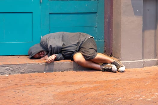 New Orleans, USA - October 25, 2023: homeless people sleep over night at the walkway in the BOURBON STREET IN New Orleans, USA.