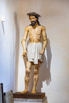 San Antonio, USA - October 31, 2023: statue of Jesus inside  mission Espada  at San Antonio mission trail, an Unesco world heritage site.