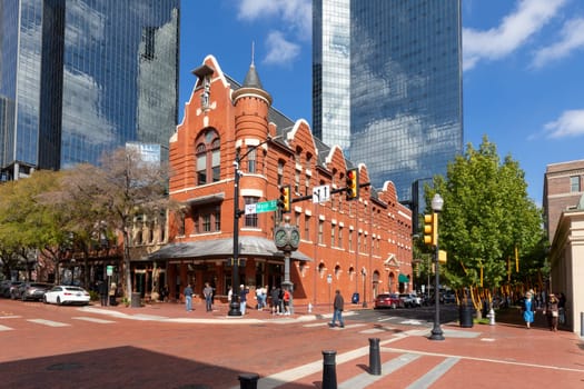 Fort Worth, Texas - November 4, 2023: Wells Fargo tower and historic bar and living house in Fort Worth at Main street.