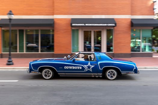 Fort Worth, Texas - November 4, 2023: old 1974 Chevrolet Monte Carlo pimped with letter Cowboy crusing in downtown Fort Worth.