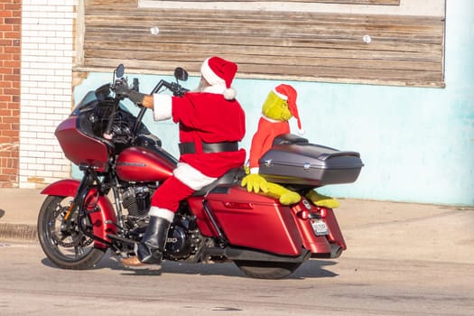 Fort Worth, Texas - November 4, 2023: Santa claus riding on a Harley Davidson to Stockyards in Fort Worth.
