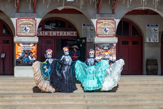 Fort Worth, Texas - November 5, 2023: mexican women pose for the day of the dead in western clothes at the stockyards in Fort Worth, Texas, USA..