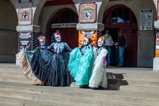 Fort Worth, Texas - November 5, 2023: mexican women pose for the day of the dead in western clothes at the stockyards in Fort Worth, Texas, USA..