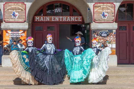 Fort Worth, Texas - November 5, 2023: mexican women pose for the day of the dead in western clothes at the stockyards in Fort Worth, Texas, USA..