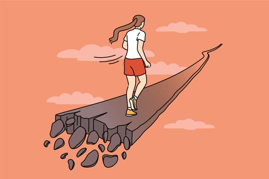 Woman runs along crumbling path, for concept of overcoming problems and escaping from crisis. Last chance to save yourself for girl who needs help getting out of personal or career crisis