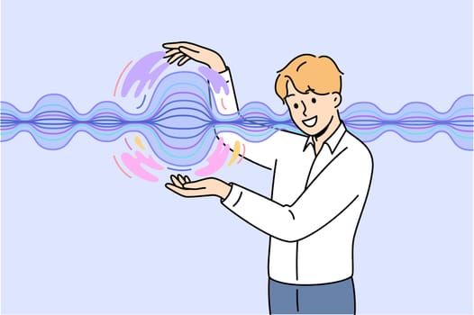 Man stands near energy wave, demonstrating results scientific experiments on physical phenomena. Business guy touches energy wave that allows you to quickly transmit commercially important information