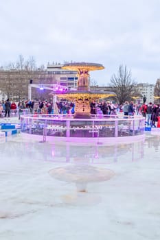 Wiesbaden, Germany - December 29, 2023: people enjoy the rink in front of the kurhaus in Wiesbaden, Hesse, germany.